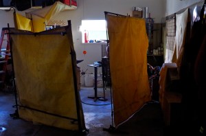 home made frames for the welding curtains. scraps and pieces welded together still standing!!